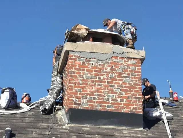 Eastvale Chimney Sweep installing a custom chimney crown in Eastvale, CA