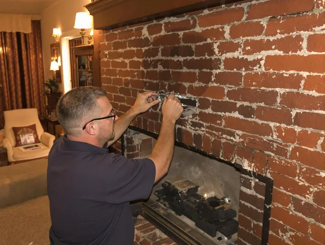 Eastvale Chimney Sweep expert fixing a fireplace in Eastvale, CA